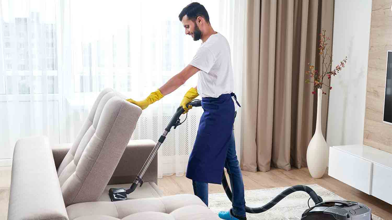 man-home-cleaning-service-vacuuming man-home-cleaning-service-vacuuming